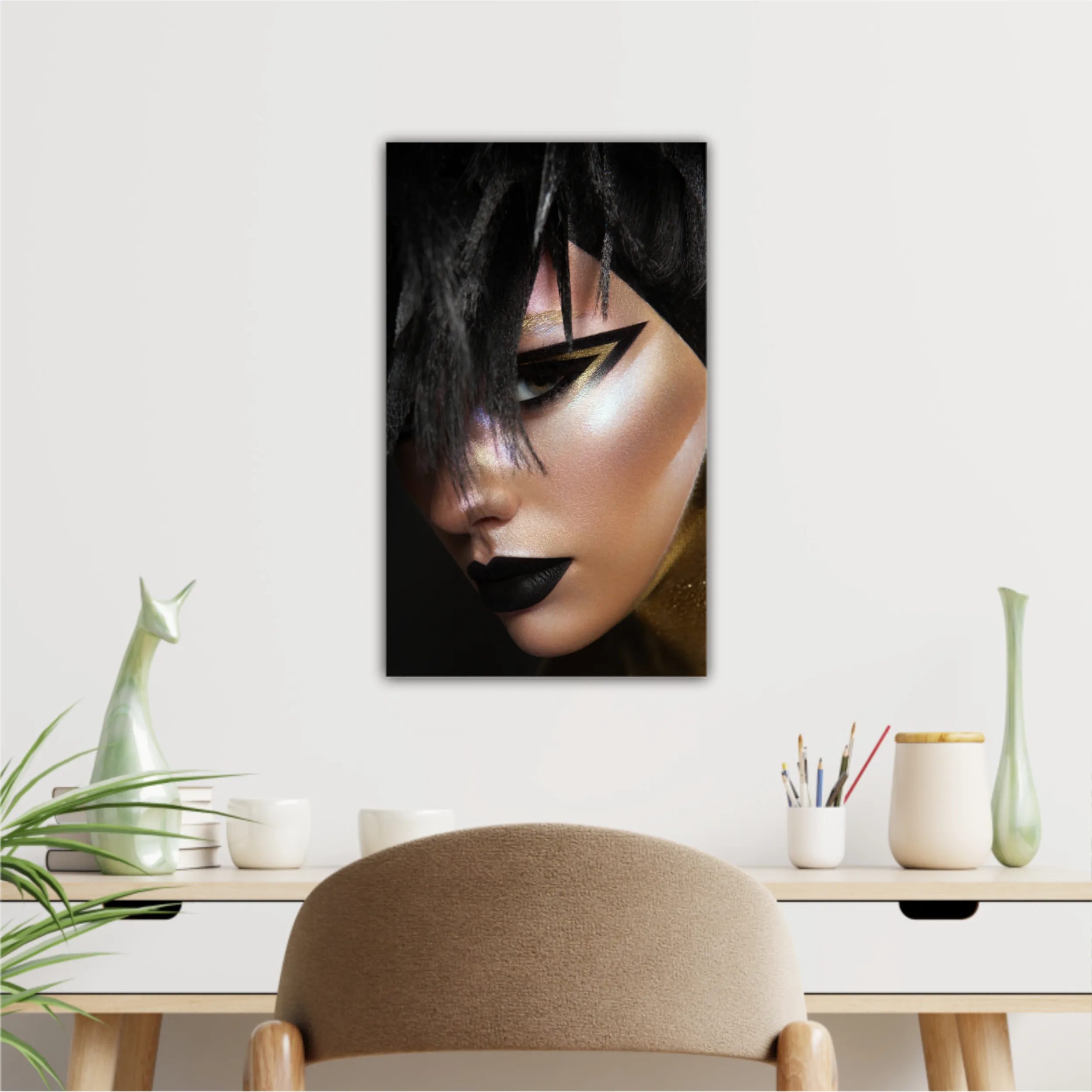 Studio beauty portrait of young woman with black graphic makeup