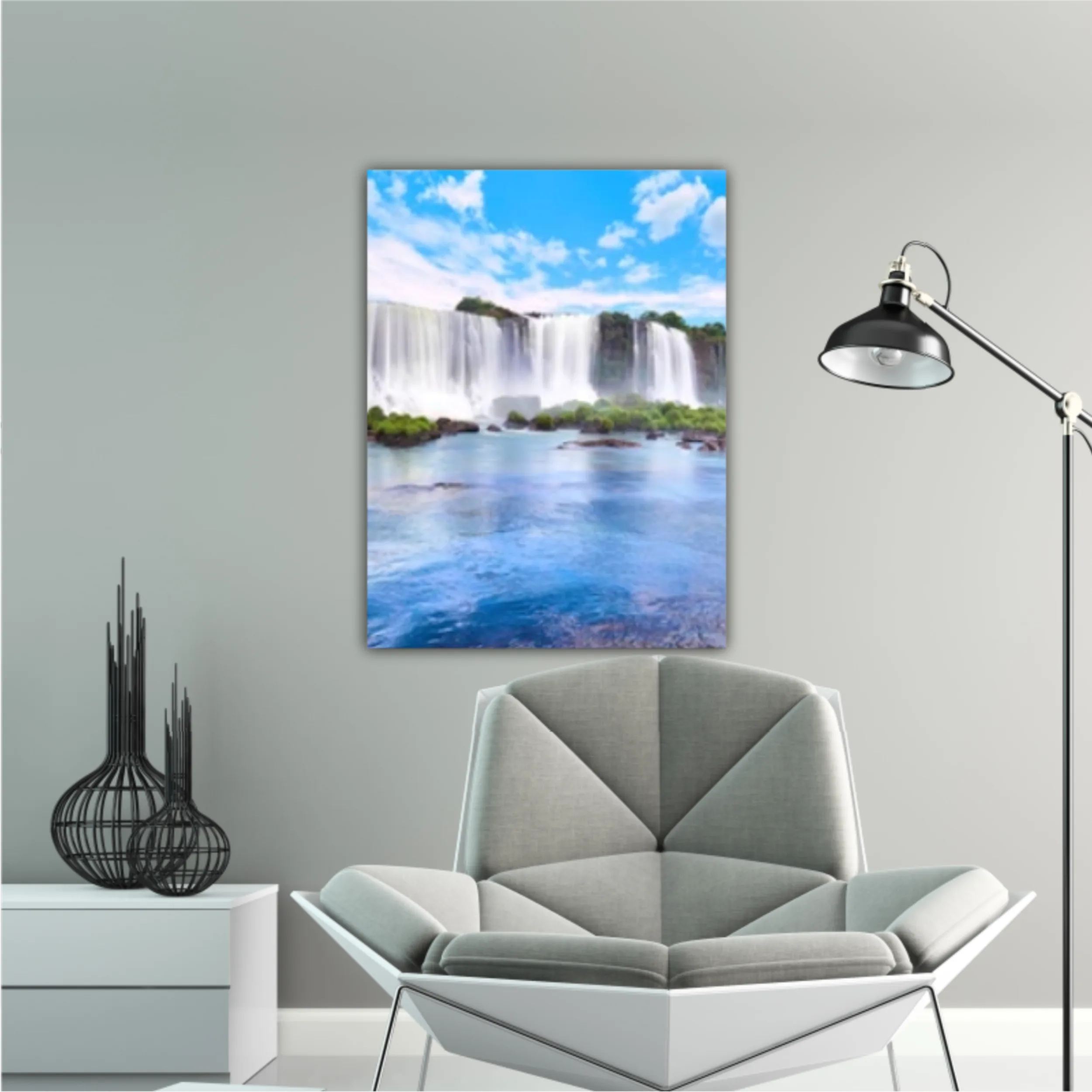 Panoramic view of many majestic powerful water cascades with mist and reflection of blue sky with clouds. Panoramic image of Iguazu valley